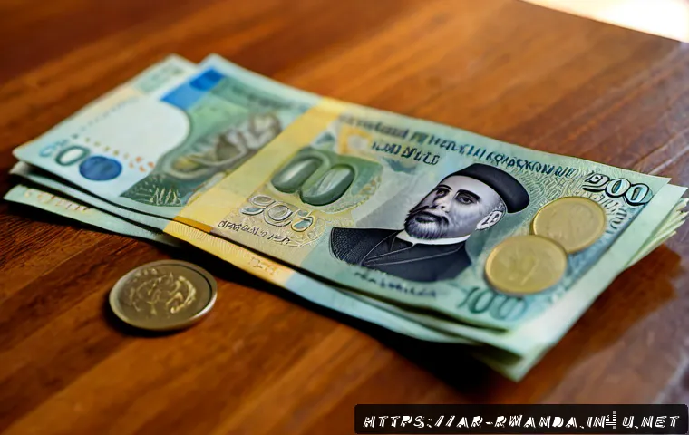 르완다의 공용 화폐 - Photorealistic close-up of neatly arranged Rwandan franc banknotes and coins on a polished wooden ta...
